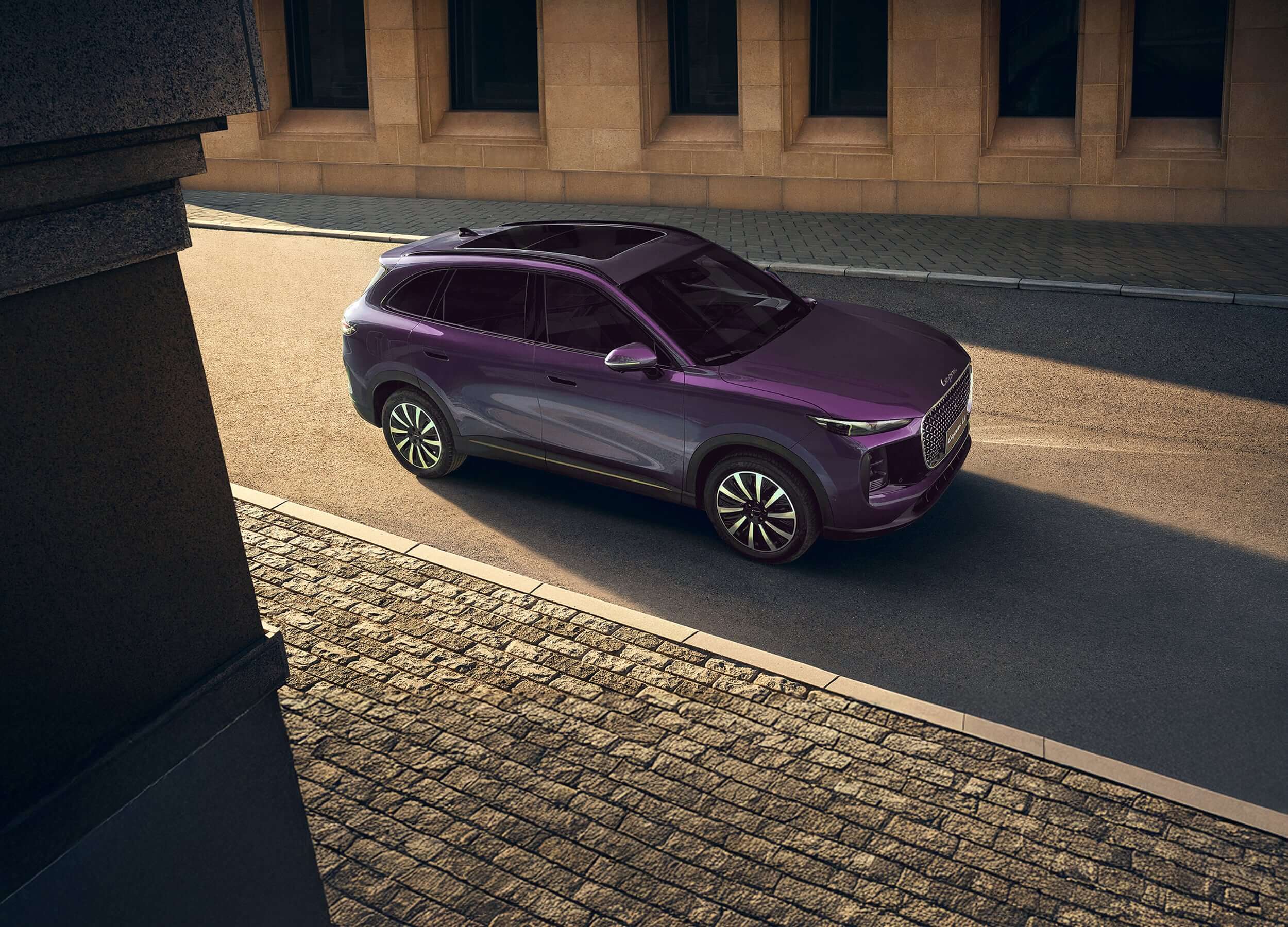 High-angle view of a purple Lepas L8 with panoramic sunroof on a city street